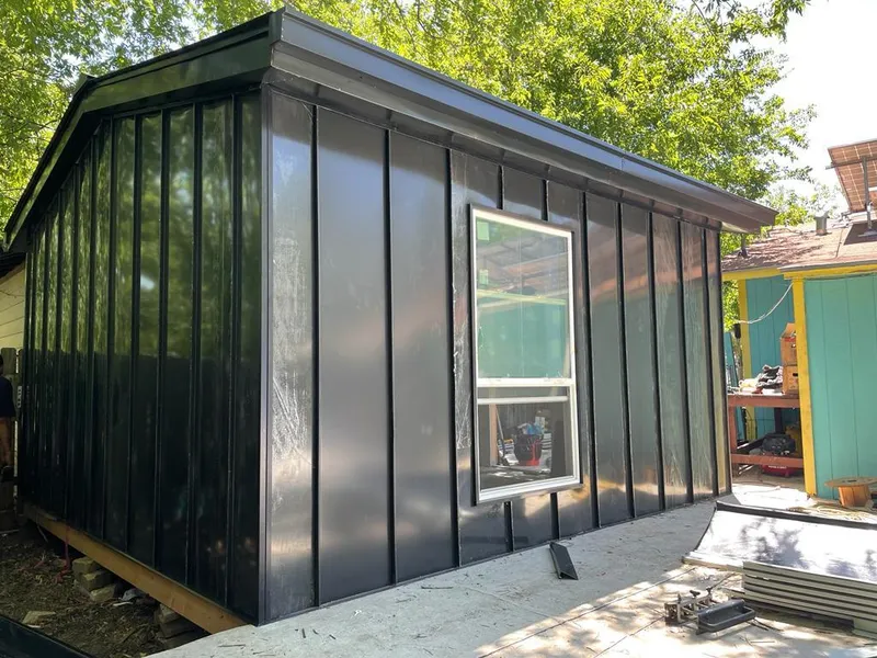 Black standing seam metal wall panels for Metal Roof Installation in Albion